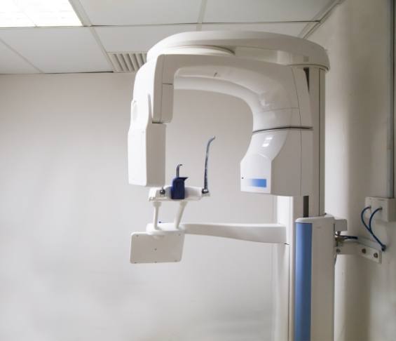 C T cone beam scanner against white wall of dental office