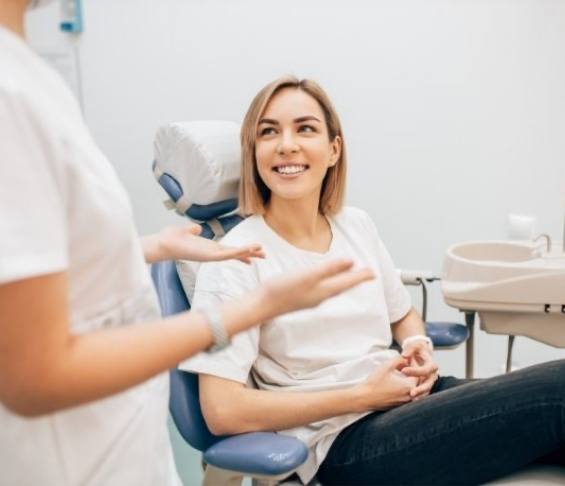 Dental patient listening to her dentist