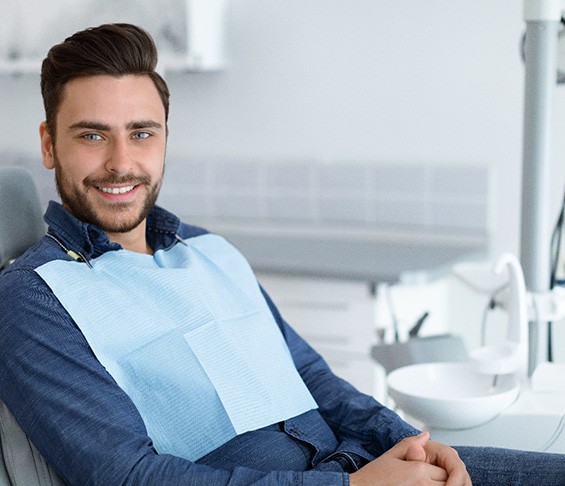 Male endodontic patient sitting in chair